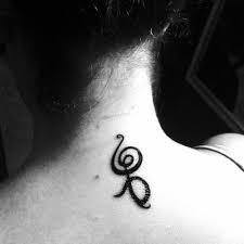 Most often tattooed as a single symbol. Upper Back Tattoo Of The Hakuna Matata Symbol