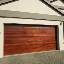 Wooden garages, double garages and timber carports. Horizontal Slatted Timber Garage Doors Doors Galore