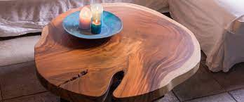 The coffee table has a traditional design that will look charming in a classic or rustic decor setting. Tree Trunk Coffee Tables Unik Living Unique Coffee Tables