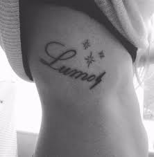 Harry Potter Lumos Tattoo On Ribs To Remind Of The Quote Happiness Can Be Found In The Darkest If Times If One Only Rem Lumos Tattoo Tattoos Tattoo On Ribs
