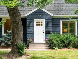 This home exterior has cedar shake siding in sherwin williams 2851 sage green light stain color with cedar trim and natural stone accents. 18 Exterior Paint Colors Trending Now