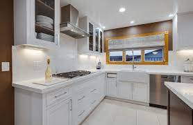 The combination of a light solid color with a dark stain on the island creates a visual masterpiece. My Very Own White Kitchen Design In Malibu Abby Rose
