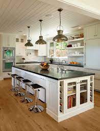 A combination of kitchen island lighting fixtures may be the best solution; Source List 20 Pendants That Illuminate The Kitchen Island