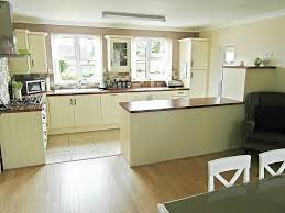 Tumbled natural stone slate and tiles are also perfect for fitting in with any kitchen decor. Cream Kitchen Units With White Tiles Novocom Top
