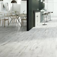 Shaw's grey, laminate flooring comes in a wide variety of styles, including wood laminate patterns. Light Grey Wood Effect Floor Tiles Wood Flooring