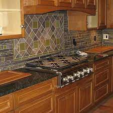 The mosaic design will surely grab the attention of anyone in the room. Kitchen Backsplash Tile Kitchen Backsplash Ideas Tile Materials