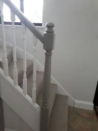 The hand rail, the thicker newel. Grey And White Banister White Banister Stair Bannister Ideas Banister Remodel