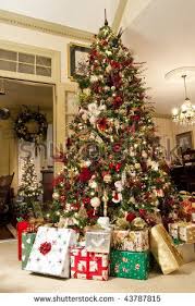A Nicely Decorated Christmas Tree With Presents In A Family Home Stock Photo 437878 Red Christmas Decor Christmas Tree With Presents Christmas Tree Decorations