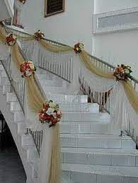 This feature begs for decorations like wreaths, ribbons and tulle. 17 Staircase Tulle Ideas Wedding Staircase Staircase Decor Stair Decor
