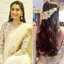 Loved Sonam Kapoor S Latest Look Especially The Hair Twisted Braid Loose Curls And Mogra Could Saree Hairstyles Indian Wedding Hairstyles Indian Hairstyles