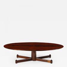 All solid hardwood midcentury oval top coffee table with splined legs and small oval lower shelf; Brazilian Mid Century Modern Oval Coffee Table 1950s