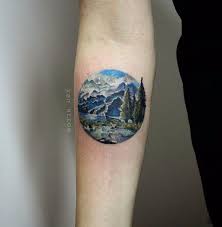 Small Realistic Mountains Scene In Circle Tattoo On Forearm Jpg 592 604 Landscape Tattoo Circle Tattoos Mountain Tattoo