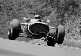 Motorsportsarchives Jo Siffert Gets The Front Wheels Off The Ground As He Drives The 14 Rob Walker Racing Team Classic Racing Cars Vintage Race Car Maserati