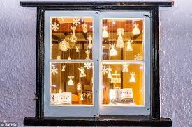 Villagers Turn 24 Of Their Houses Into A Real Life Advent Calendar Christmas Window Display Home Christmas Advent Calendar Christmas Window Display