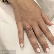 Olive Branch Tattoo On The Ring Finger Olive Branch Tattoo Small Finger Tattoos Ring Finger Tattoos