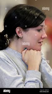Rachel McNally, a friend of Will Norton grieves before a news conference  with family members at Freeman Hospital in Joplin, Mo. Saturday, May 28,  2011. Norton's body was found Friday in a