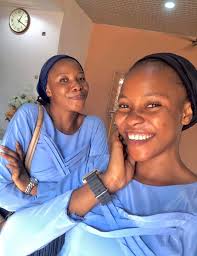 Which church do the two ladies in the photo belong to, Deeper Life or  Chosen?