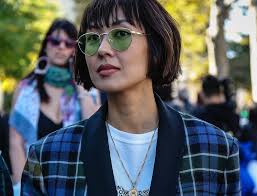 4k00:06close up and slow motion shot of short dark hair european woman with white skin sits and enjoys smelling a dark grey cup of coffee and feeling dressed casual street style. 30 Best Short Hairstyles For Pinays All Things Hair Ph