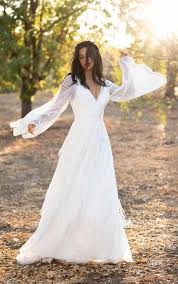 With cap sleeves and cameo back from stella york is a sweet. Romantic Boho Wedding Dress With Lace Bell Sleeves Kleinfeld Bridal