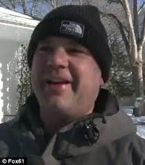 Connecticut man makes 10-foot igloo with working fireplace