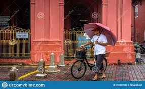 When you come to melaka and visit all the places like red house, a'famosa, menara taming sari, duck. An Adult Man With A Red Umbrella In His Hand Walking Across The Melaka Street With His Old Bicycle Editorial Stock Photo Image Of Street Lifestyle 159207083