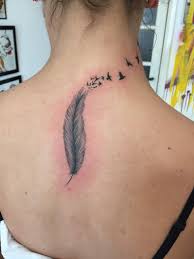 The series of symbols inked above liam's feather tattoo is actually hieroglyphics, which is the combination of alphabetic and logographic elements to form letters and words. Feather Tattoo Feather Tattoos Tattoos Feather Tattoo Design