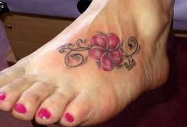 Small Colorful Hawaiian Flower Tattoo On Foot Hawaiian Tattoo Plumeria Tattoo Plumeria Flower Tattoos