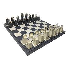First, the kings' pawns face off in the centre of the board, and then the knights, kingside for white and queenside for black defend them. Regency Italian Renzo Romagnoli Leather And Chrome Black And Cream Chess Set Chess Set Luxury Chess Sets Chess Board