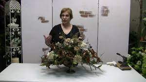 For a dinner table or coffee tables, i recommend picking a wide opening and arranging multiple flowers in a balanced and circular shape. How To Make A Traditional Floral Centerpiece Arrangement With Silk Flowers Part 1 Youtube