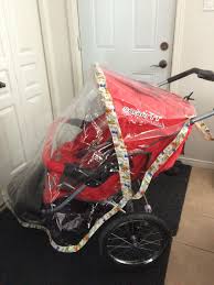 There Are No Instructions For This Diy Stroller Cover But This Will Be Perfect For Our Trip To Disney World Stroller Stroller Rain Cover Rain Cover Diy