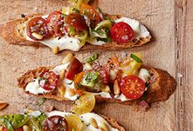 Ingredients in bruschetta with tomato and basil. To Try Ina Garten S Tomato Crostini With Whipped Feta Kristin S Favorite Recipes