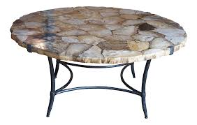 Large coffee tables feature two faux drawer accents opposite their real drawers. Vintage Arhaus Boracay Round Petrified Wood Iron Mosaic Coffee Table Chairish