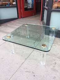 If you want to add an industrial charm to your home, achieve it through a glass coffee table with metal feet. See Through 1970s Lucite And Glass Coffee Table By Pace Casa Victoria Vintage Furniture On Los Angeles Sunset Boulevard