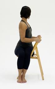 10 Yoga Poses You Can Do In A Chair Essential Yoga Poses Chair Yoga Cool Yoga Poses