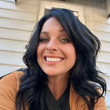 What is the value of an 8,500 sq. ft. building and adjacent land in  Lansing, Michigan?