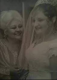 I would like to see if this pic of my deceased cousin can cleaned up enough  to be used for her obituary. You've helped with several other photos of her  and have