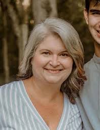 Can someone please remove my boy from my arms in the photo? I love the  photo of us all but thought it would also make a good headshot for  professional use without