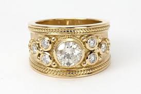A Unique Bespoke Diamond Ring Crafted In 18ct Yellow Gold Steven Stone Wide Band Engagement Ring Diamond Rings Bands Wide Band Engagement