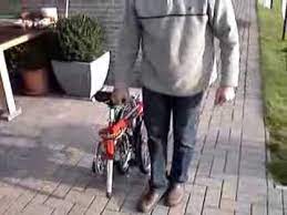 Leave the seat up and you can easily &quot;walk&quot; Dahon Folding Bicycle A Little Third Wheel Makes Transportation Easier Youtube