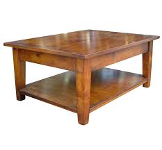 Supported by a sleek steel frame, this coffee table boasts a smooth wood tabletop and bottom shelf. Southwold Solid Cherry Wood Coffee Table With Pot Board Settle Home