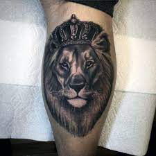 50 Lion With Crown Tattoo Designs For Men Royal Ink Ideas Lion Tattoo Lion Tattoo Design Calf Muscle Tattoo