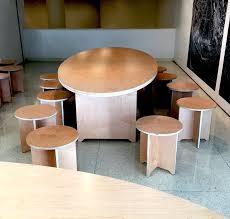 Hang a pulley above your saw table, making sure it can handle the weight of the plywood plus the dolly. Guggenheim S Clever Baltic Birch Tables And Chairs Improvised Life
