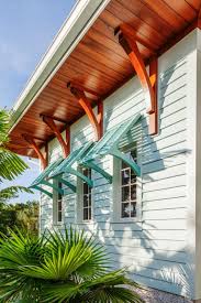 Island Style Home Boasts Blue Bahama Shutters Beach House Decor Beach Cottage Style House Exterior