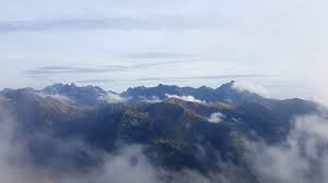 The p sign means poland and u can see s which means slovakia at the back of the p. A Glimpse Of Slovakia Through The Clouds Tatry Mountains Poland Slovakia Border Europe