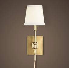 Showcase the library wall sconce above an artwork or shelving unit to create dramatic and elevated layering in your home. Library Sconce