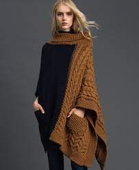 Work proceeds up to and over shoulders, then down to lower front edge. Cable Knit Poncho Woman Blue Twinset Milano