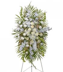 Order funeral sprays from funeral flowers and our online flower shop, and you won't have a problem finding one that you're happy with it terms of colour, we have plenty of funeral sprays that are neutral colours, that consist of whites, like lily sprays, with yellow and light blue flowers. All White Standing Spray Funeral Flowers In Catonsville Md Blue Iris Flowers