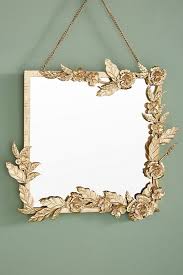 Try this project that i came up with and it only costs $2.00 ($3 if you include the adhesive.lol!) everything came from the dollar store! Decorative Mirrors That Double As Wall Art Stylish Artistic Mirrors Apartment Therapy