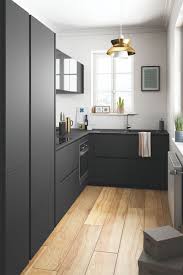 A stunning marble countertop and subtle gray backsplash joins white shaker style cabinetry and black stainless appliances. How To Renovate A Small Kitchen