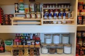 Hang ikea spice racks on the back of the closet door to store bulky cleaning supplies. Super Easy Tiered Pantry Organisers No Hacking Required Ikea Hackers